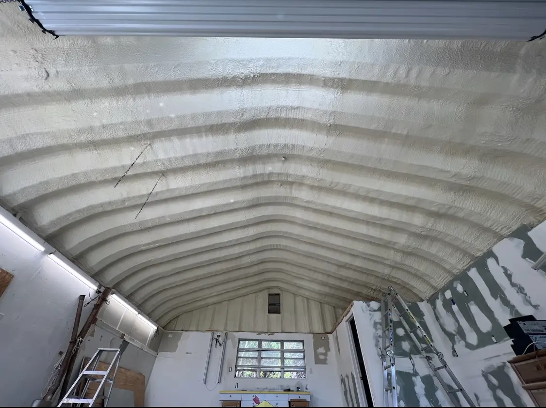 Spray polyurethane foam applied to the underside of a metal roof deck in Elkridge